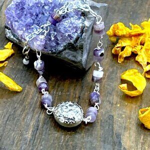 Amethyst and silver charm adorned luxury bracelet